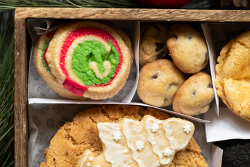 Variety of Christmas cookies in a wooden box decorated for Christmas present - Christmas content - Christmas Eve culinary traditions