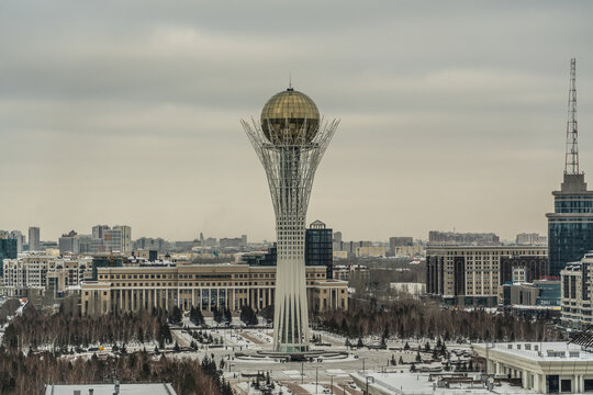 Nur-Sultan, Kasachstan, December 2020, Baiterek Tower (Bayterek Tower), a monument and observation tower in Nur-Sultan and the Ministry of Foreign Affairs in the rear 