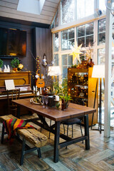 served table in a country house decorated for the Christmas holidays.