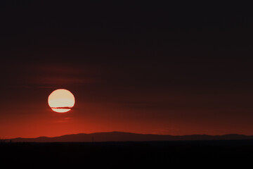 The sun, the sky sunset sun and clouds, bright twilight background. Everything lies above the surface of the atmosphere.