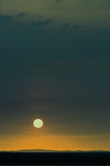 The sun, the sky sunset sun and clouds, bright twilight background. Everything lies above the surface of the atmosphere.