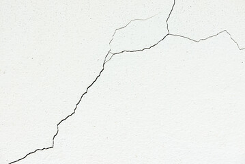 Image for use as a background, diagonally cracked white wall, which is still a small line, not very large. Which the renovation is still easy