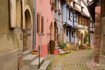 Quaint Village in Alsace with Colorful Old Exposed Timbered Buildings and Cobblestone Street