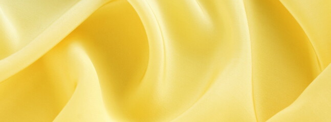 Obraz premium silk fabric texture yellow color . copy space.Fabric background.