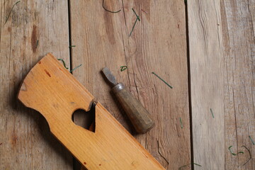 carpenter's tools lie on a wooden table clamp plane
