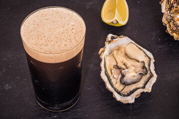  Raw Oyster and Stout with a Lemon Wedge, an Irish Cuisine Speciality © Dietmar