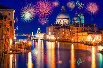 Grand canal and Basilica Santa Maria della Salute with fireworks in Venice, Italy