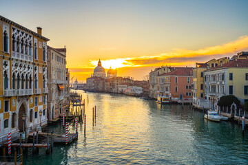 Fototapeta na wymiar Grand Canal and Basilica Santa Maria della Salute at sunrise in Venice