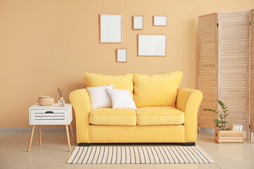 Stylish interior of room with cozy sofa