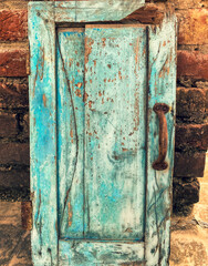 An old rusty vintage metal door