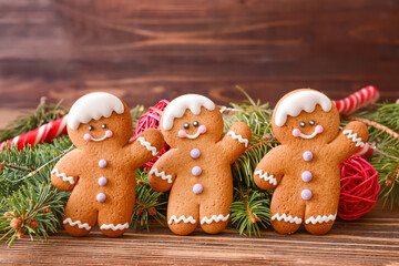 Christmas composition with gingerbread cookies on wooden background - Powered by Adobe