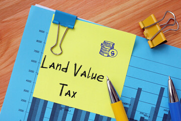 Business concept meaning Land Value Tax with phrase on the piece of paper.