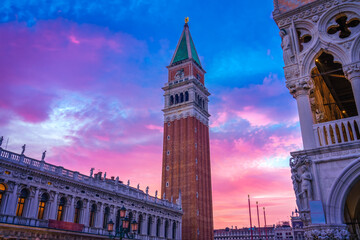 Fototapeta na wymiar San Marco Campanile tower at beautiful sunset in Venice, Italy 
