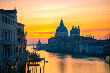 Fototapeta na wymiar Beautiful sunrise view of Grand Canal and Basilica Santa Maria della Salute in Venice, Italy