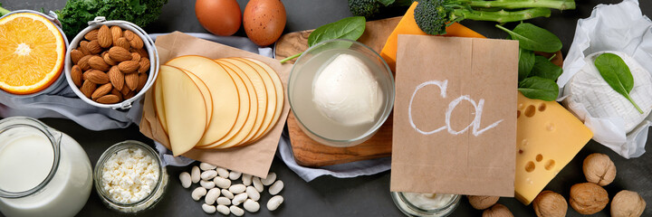 Healthy diary and non-diary products rich in calcium on dark background