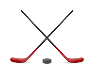 Hockey sticks and puck