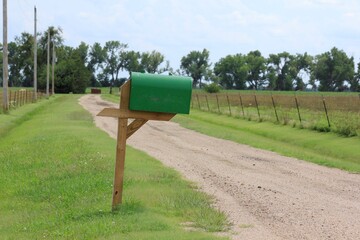 mailbox on the grass by a farm driveway north of Hutchinson Kansas USA out in the country.