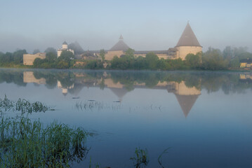 View of the Old Ladoga fortress on a foggy June morning. Staraya Ladoga, Russia