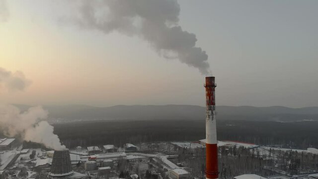 Factory pipe polluting air, environmental problems. Industrial factory pollution, smokestack exhaust gases. Climate change, ecology, atmoshere gas, ozone layer