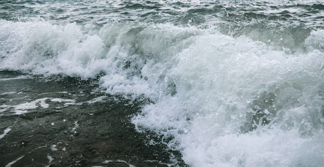 Wave in the sea with splashing water.