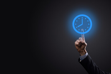 Businessman hand holds the icon of hours clock with arrow. Rapid execution of the work.Business...