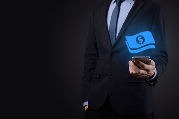 Businessman man holding money coin icon in his hands.Growing money concept for business investment and finance. USD or US dollar on dark tone background