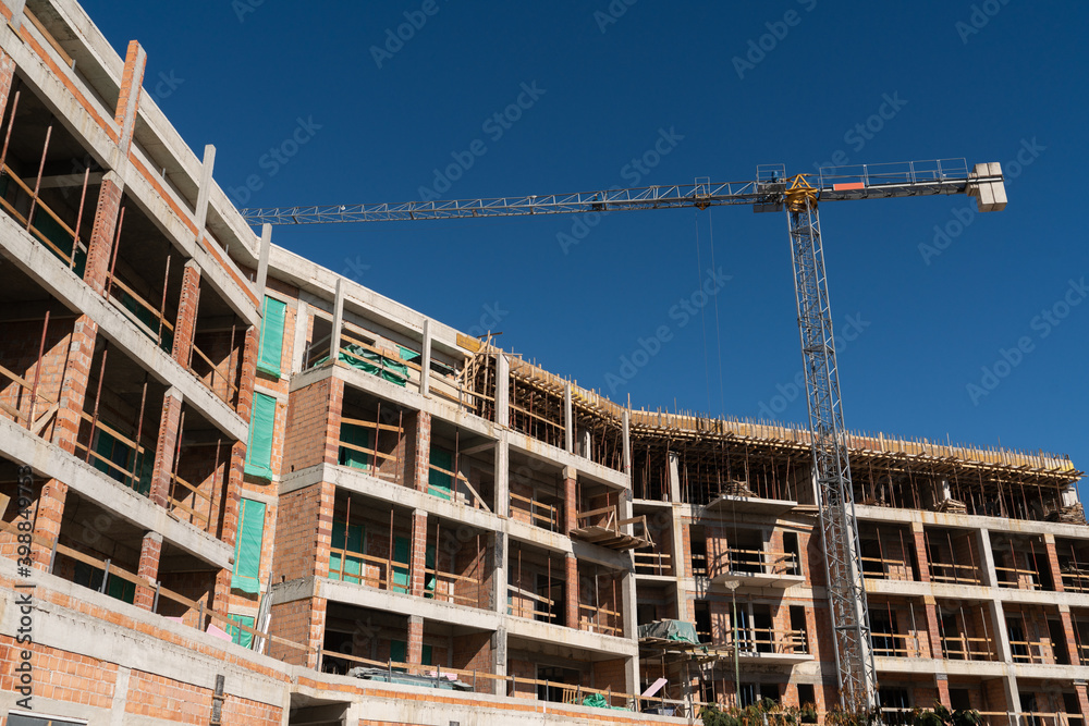 Aufkleber construction of a building with a remotely controlled unmanned crane