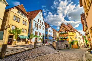 Fototapeta na wymiar Untere Schmiedgasse street at the old town of Rothenburg ob der Tauber. Bavaria, Germany