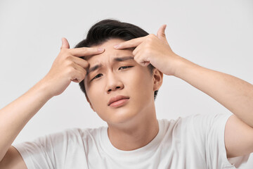 young man caring about acne, men's skincare concept