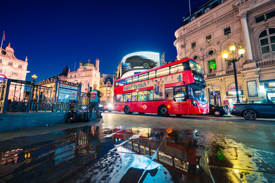 Piccadilly Circus in London at night.Piccadilly Circus is a road junction and public space of London's West End in the City of Westminster: LONDON,ENGLAND - AUGUST 16,2018