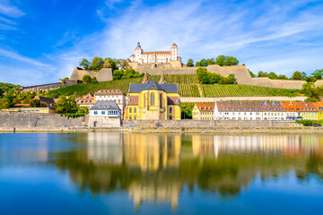 Saint Burkard Catholic Church near Marienberg Fortress at river Main in Wurzburg. Germany