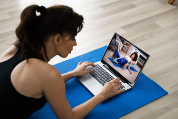 Watching Online Yoga Video Program Exercise On Laptop Computer
