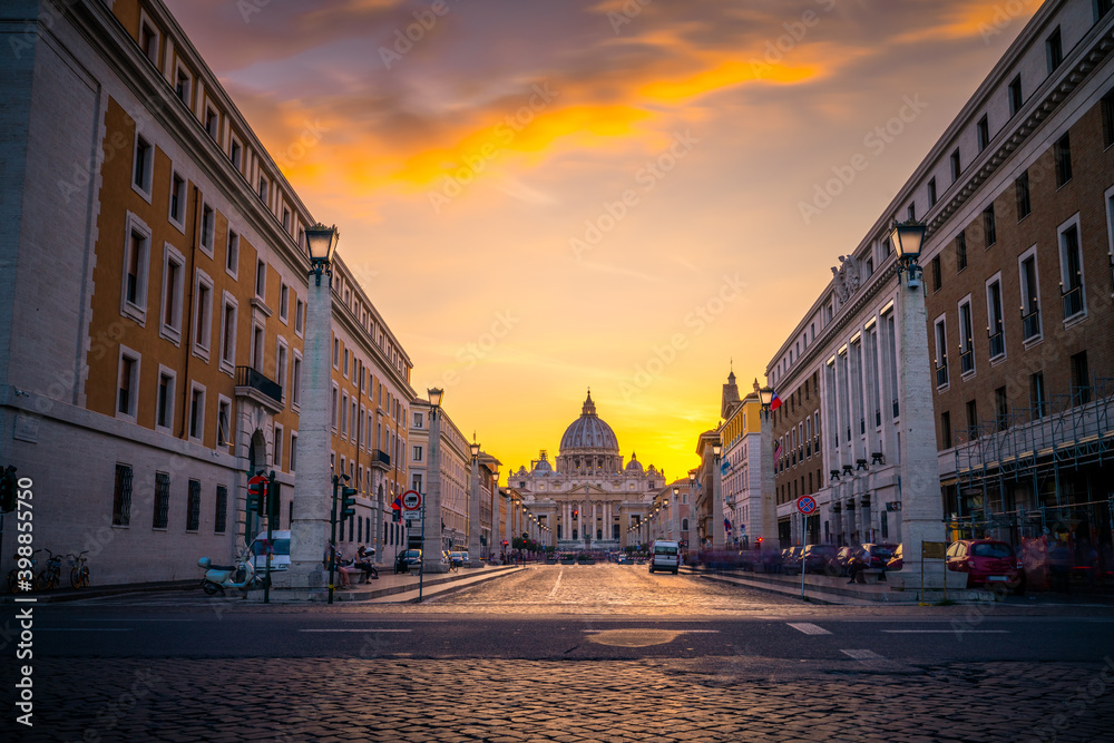 Wall mural St. Peter's basilica at sunset viewed across Via della Conciliazione street  