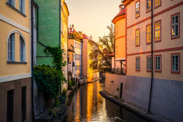 Fototapeta na wymiar Water canal at sunrise. Old Prague. Czech Republic 