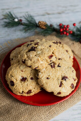 Homemade oatmeal and blueberry cookies on a red Christmas plate - christmas eve cookies - healthy food and snacks