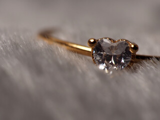Close up shoot of gold ring with beautiful diamond, isolated on white