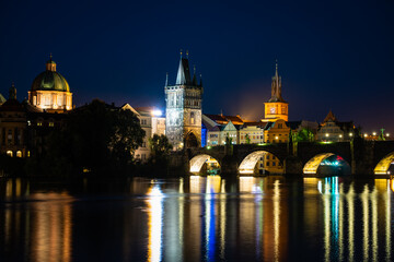 Fototapeta na wymiar Charles bridge and old tower at night in Prague, Czech Republic