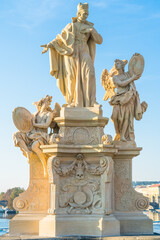 Obraz premium Christian stone sculpture on the Charles bridge in Prague, Czech Republic