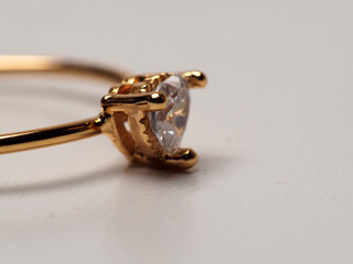 Close up shoot of gold ring with beautiful diamond, isolated on white