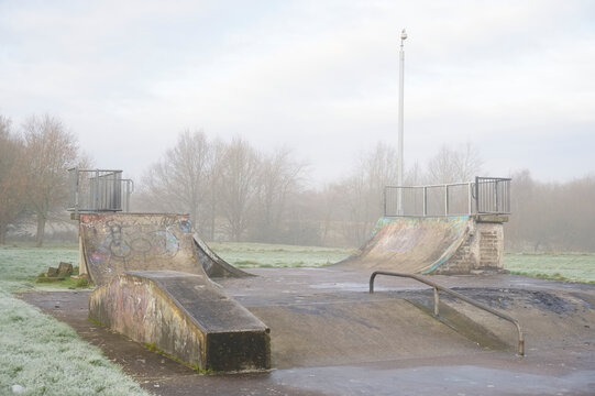 Skateboard concrete park empty derelict playground in winter