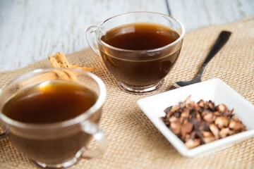 Cups of black tea on white woods on a cold morning - tea time