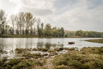 Novi Sad, Serbia - November 15. 2020: A forgotten fishing boat in the tributary of the Danube near Novi Sad, Serbia 