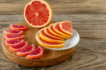 citrus jelly slices in sugar. marmalade slices of oranges and grapefruits on cutting board