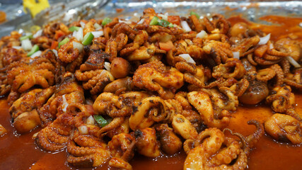 Close up Fried squid with Korean spicy sauce