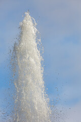 Water fountain in park with blue sky