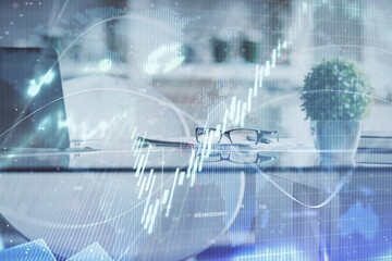 Fototapeta na wymiar Double exposure of financial graph drawing and office interior background. Concept of stock market.