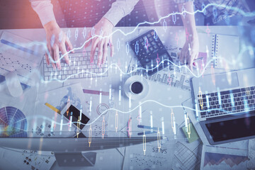 Double exposure of man and woman working together and financial chart hologram drawing. market analysis concept. Computer background. Top View.