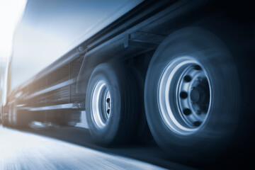 Speed blur motion of semi trailer truck driving on road. trucks loistics. Cargo freight truck transportation.