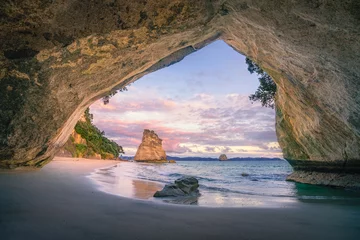 Rolgordijnen view from the cave at cathedral cove beach at sunrise,coromandel,new zealand © Christian B.
