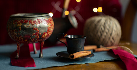Christmas still life. Coffee, cinnamon, lights. Cozy atmosphere. 